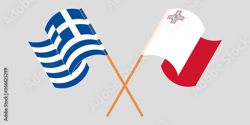 Crossed and waving flags of Malta and Greece