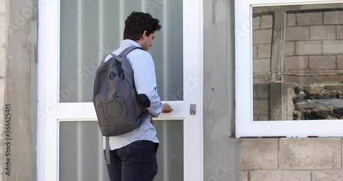 Young elegant man leaving home to go to school