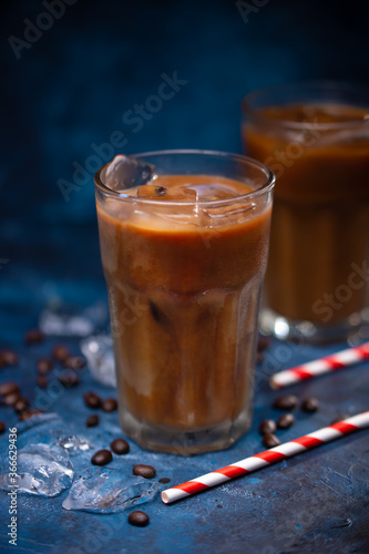 Cold summer drink, coffee with milk, coffee beans, summer mood