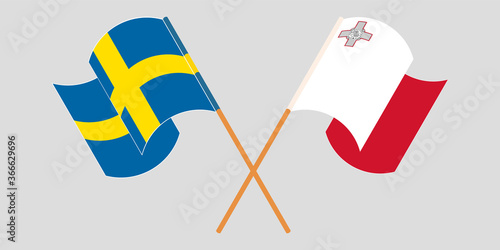 Crossed and waving flags of Malta and Sweden