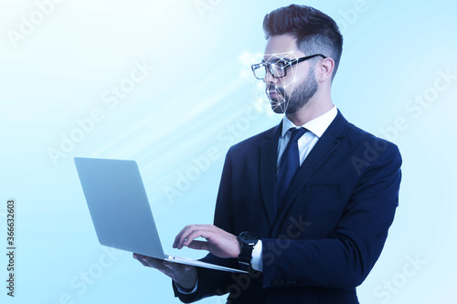 Facial recognition system. Man using laptop on light blue background