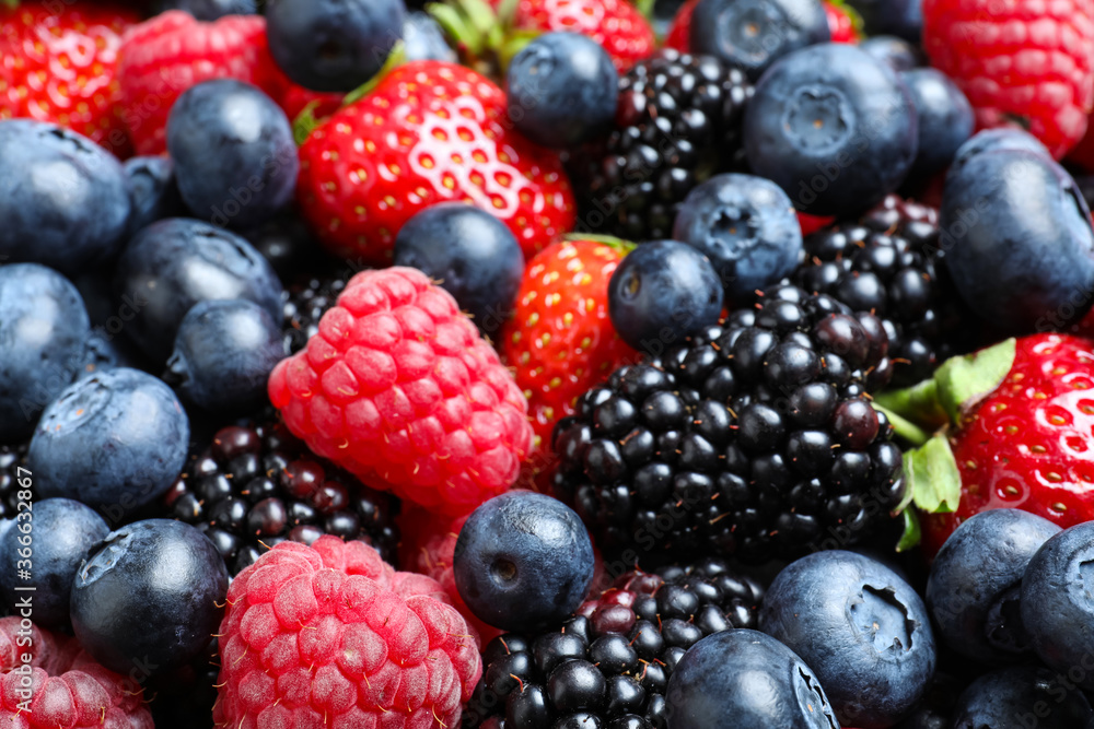 Mix of different ripe tasty berries as background, closeup view Mix of different ripe tasty berries as background, closeup view