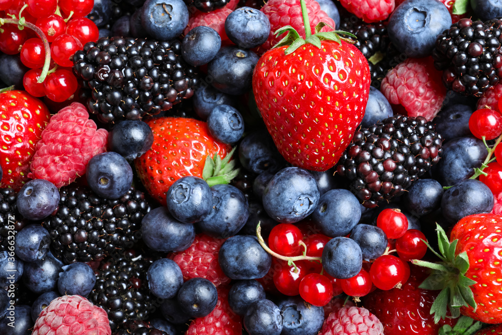 Mix of different ripe tasty berries as background, top view Mix of different ripe tasty berries as background, top view