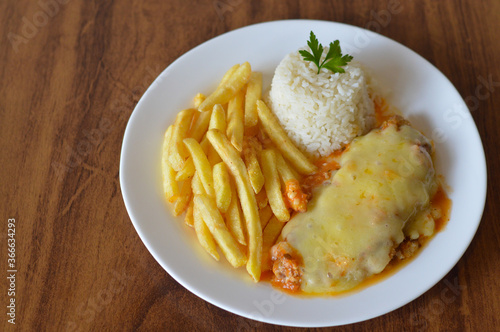 parmegiana chicken with french fries  