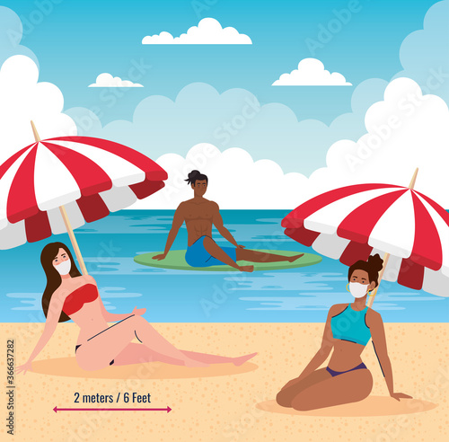 social distancing on the beach  people keep distance wearing medical mask  new normal summer beach concept after coronavirus or covid 19
