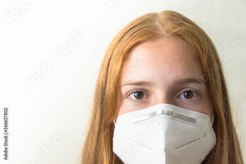 red-haired girl with face mask