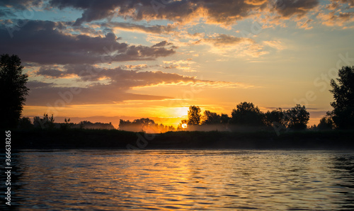 sunrise over the river morning sun under the river © Evgeniya