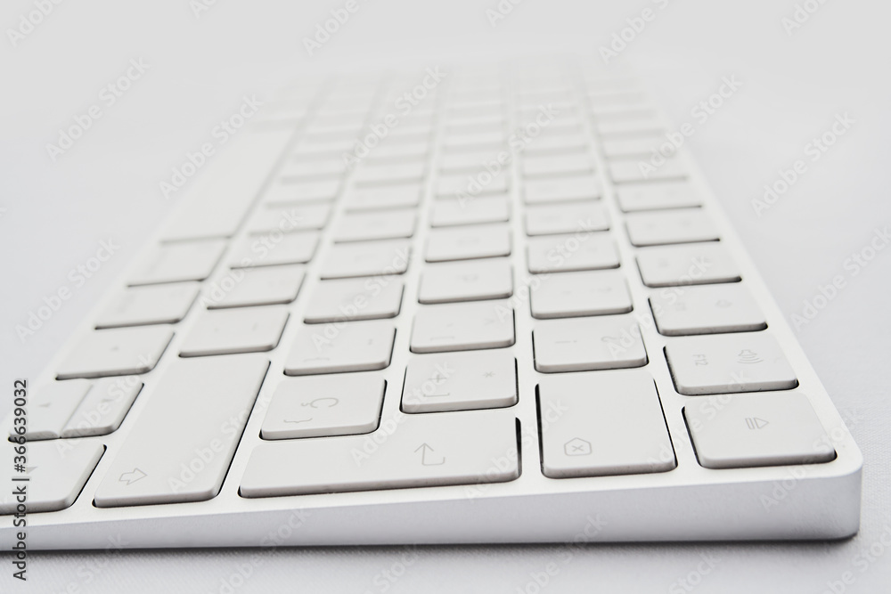 modern wireless keyboard on white background, perspective view