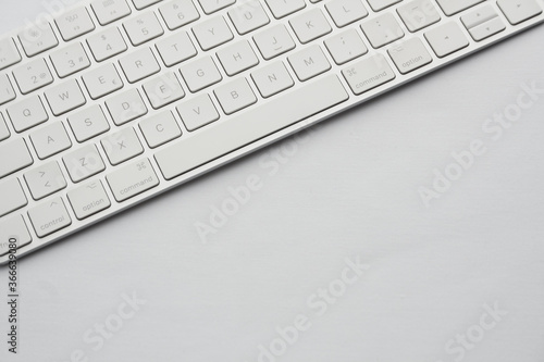 white elegant computer keyboard detail, tilted top view