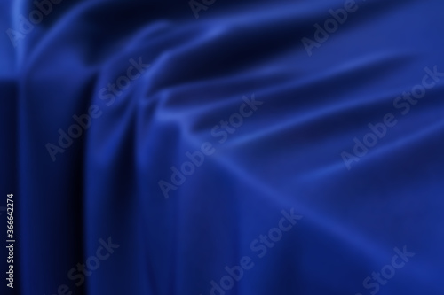 Blurred dark blue silk texture.