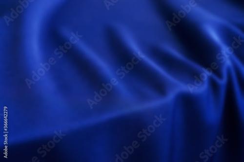 Blurred dark blue silk texture.