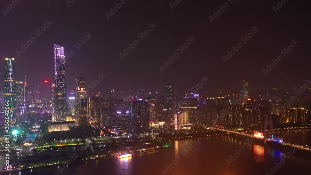 night illuminated guangzhou city modern downtown famous towers riverside bay aerial panorama 4k china night illuminated guangzhou city modern downtown famous towers riverside bay aerial panorama 4k china