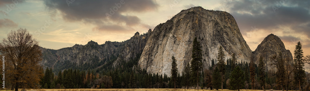 Grassland and rock mountain panorama with clouds