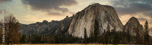 Grassland and rock mountain panorama with clouds
