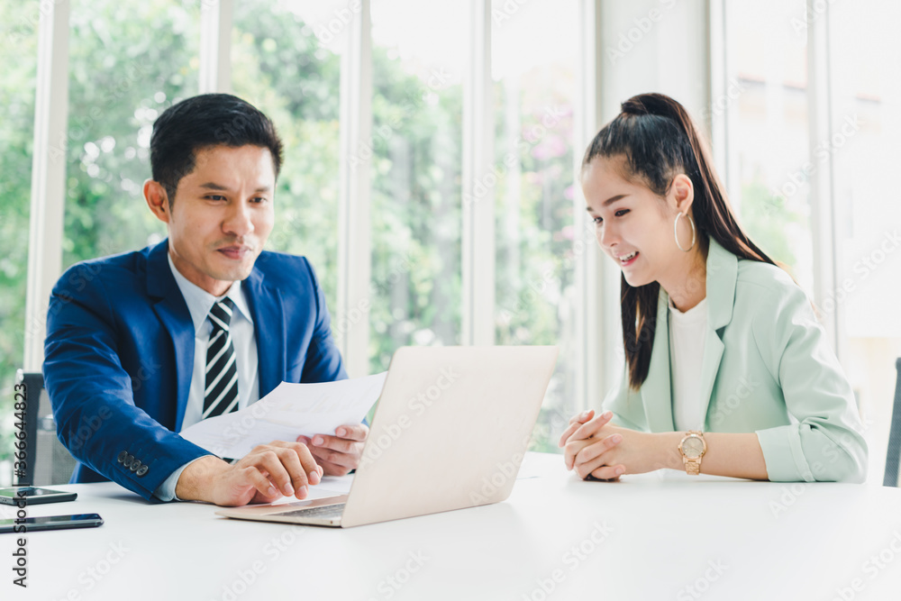 Managers and secretaries meeting and discussing business results from notebooks and paper charging statistics are in the company. Managers and secretaries meeting and discussing business results from notebooks and paper charging statistics are in the company.