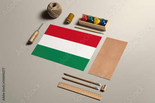Photography Hungary calligraphy concept, accessories and tools for beautiful handwriting, pencils, pens, ink, brush, craft paper and cardboard crafting on wooden table