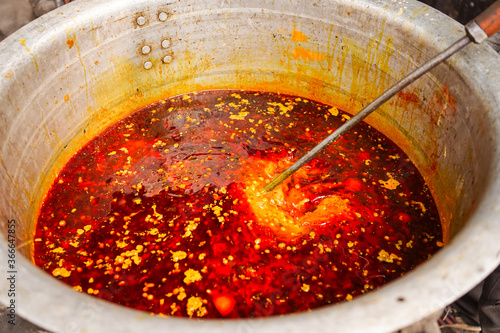Obraz na płótnie Masala spicy sauce prepared in large pot in Indian village w salonie