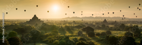 Hot air balloon over plain of Bagan in misty morning  Myanmar at sunrise