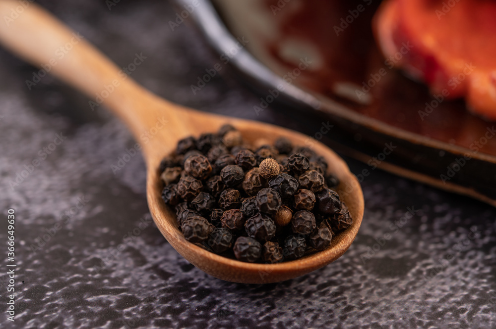 Pepper seeds in a wooden spoon. Pepper seeds in a wooden spoon.