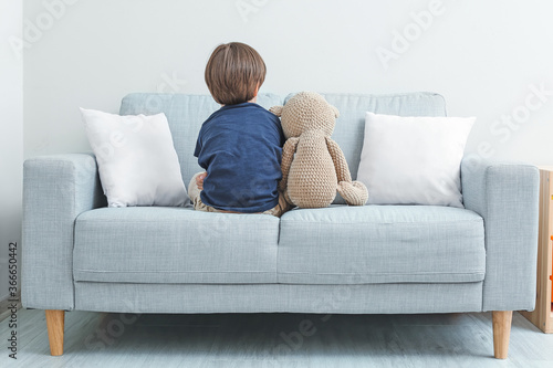 Sad little boy with autisti...