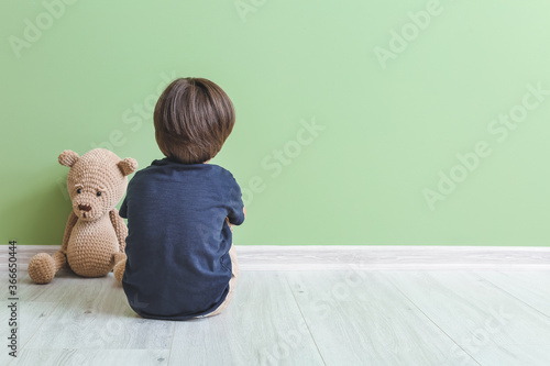 Sad little boy with autisti...