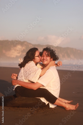 Young couple spending time together on beach.