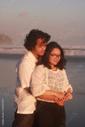 Young couple spending time together on beach.