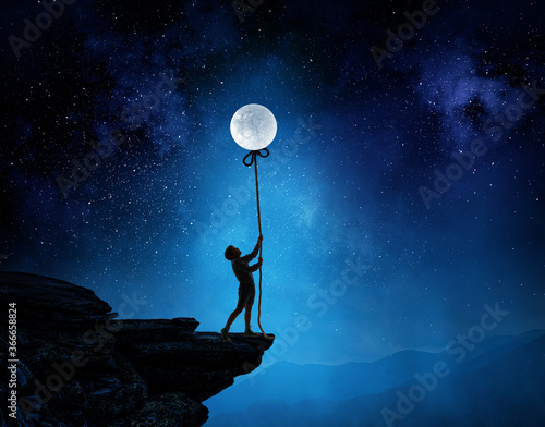 Kid boy catching moon . Mixed media
