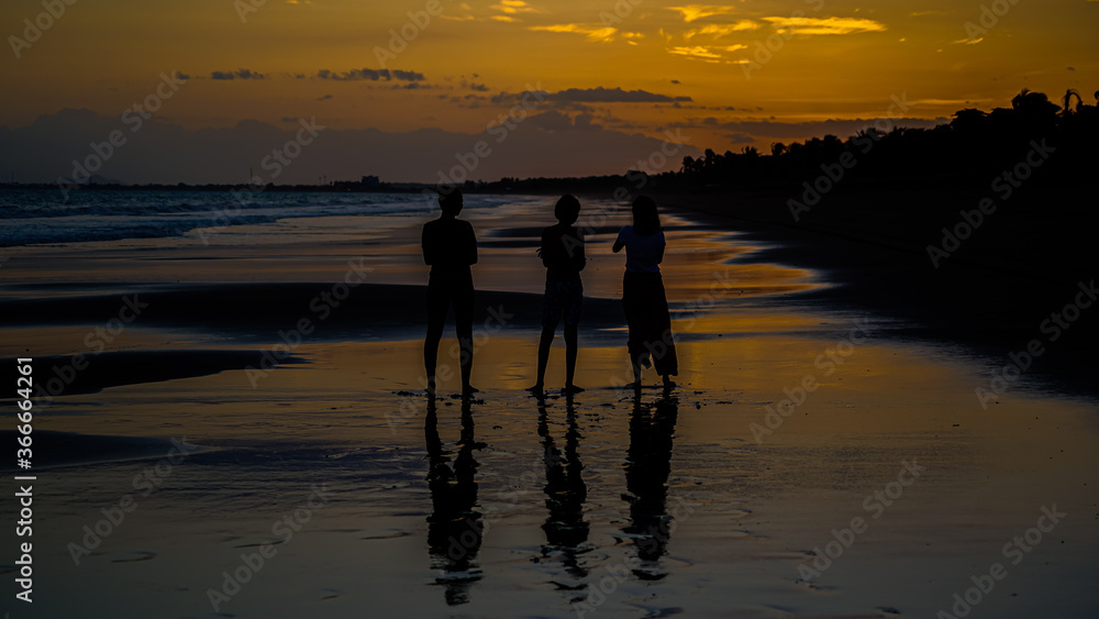 Beautiful silhouette image of Kids playing and enjoying at the Beach in Costa Rica Beautiful silhouette image of Kids playing and enjoying at the Beach in Costa Rica