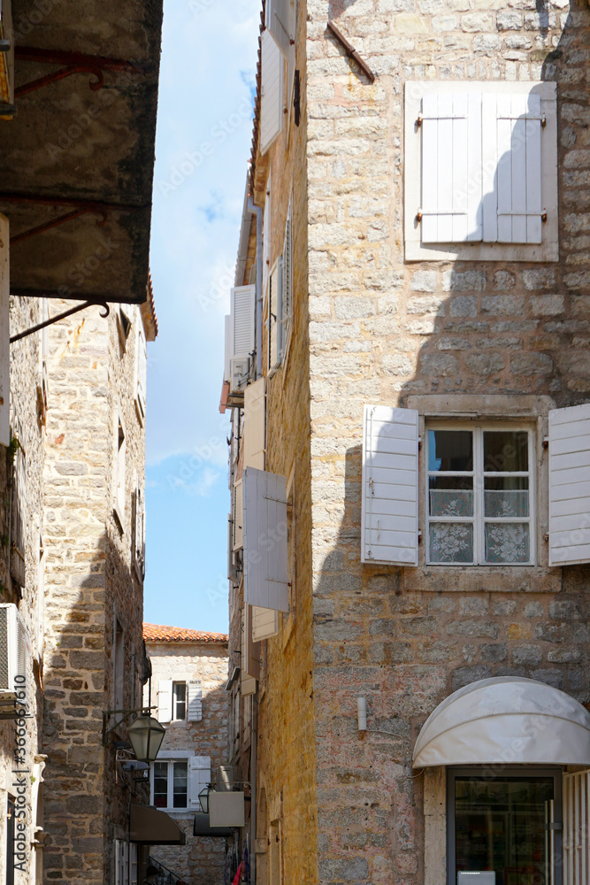 
Beautiful elements of old cities in Montenegro. Old town, street, houses windows.