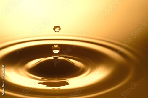 Water Drop - Pure clear and transparent of water and ripple in gold background. Creative modern concept, for graphic design, website, poster, placard and wallpaper.