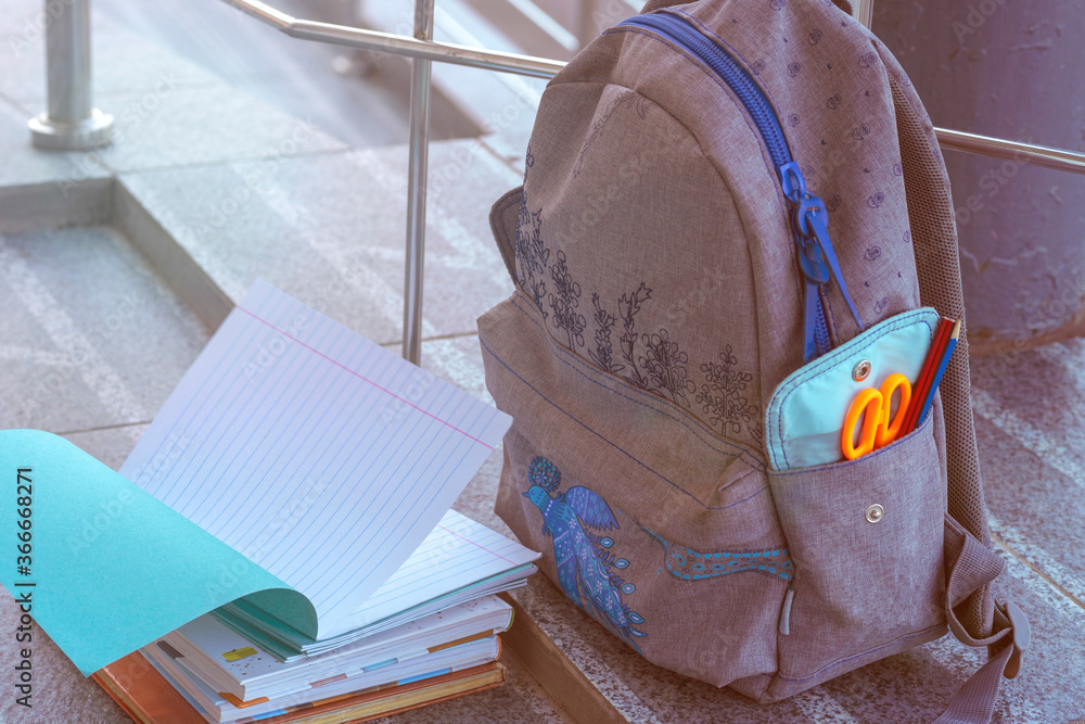 school backpack, notebooks, books close-up. supplies and objects for study. Concept  school days, pupil, learner, scholar.  student accessories