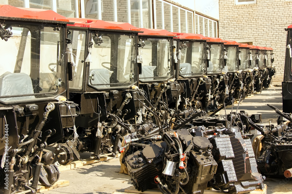 Obraz premium Tractors and cab harvesters. Agricultural machinery at the assembly plant