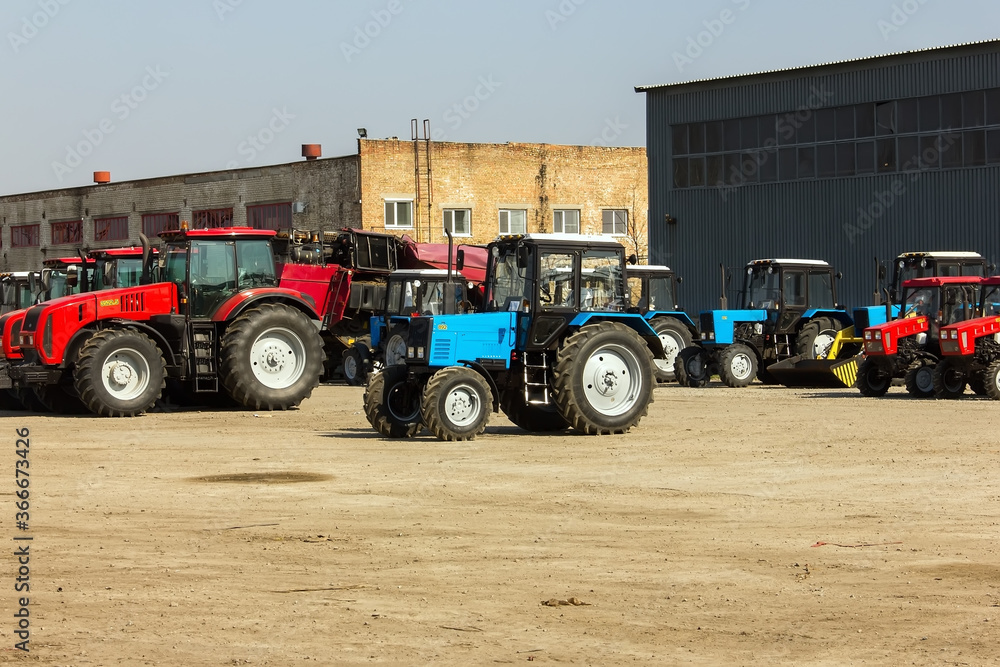 Tractors and cab harvesters. Agricultural machinery at the assembly plant