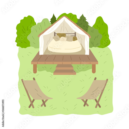 Glamping wooden house with bedroom inside surrounded by green forest and chairs
