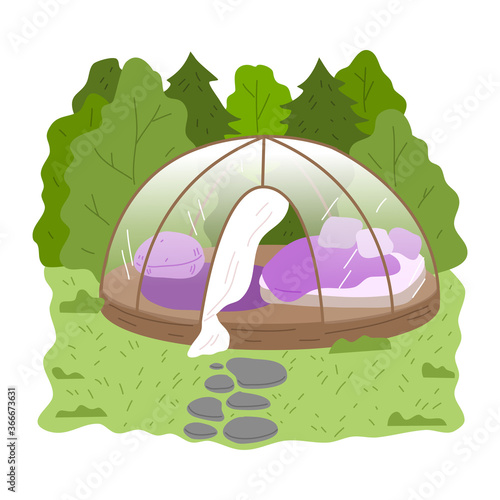 Round glass glamping house with bedroom inside surrounded by green forest