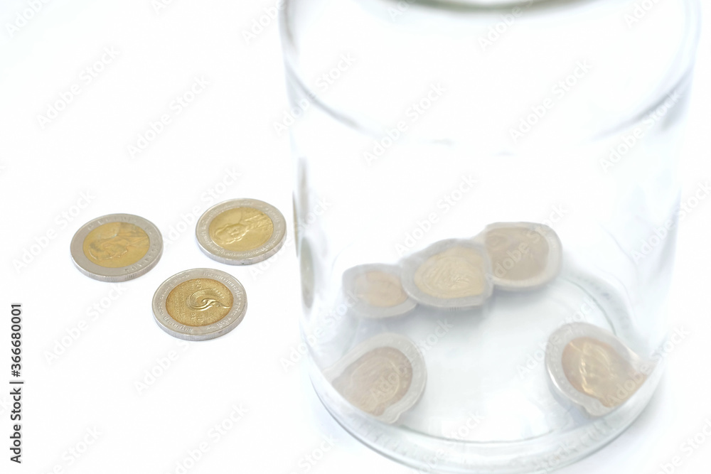 Glass bottle and coin on white background. Concept for finance health check or cost of business, financial analysis, audit or accounting. Glass bottle and coin on white background. Concept for finance health check or cost of business, financial analysis, audit or accounting.