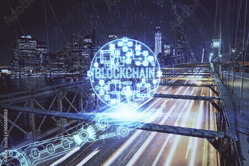 Multi exposure of cryptocurrency theme hologram drawing and city veiw background. Concept of blockchain and bitcoin.