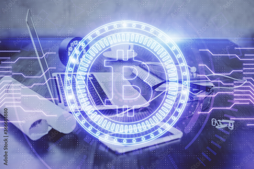 Double exposure of blockchain and crypto economy theme hologram and table with computer background. Concept of bitcoin cryptocurrency. Double exposure of blockchain and crypto economy theme hologram and table with computer background. Concept of bitcoin cryptocurrency.