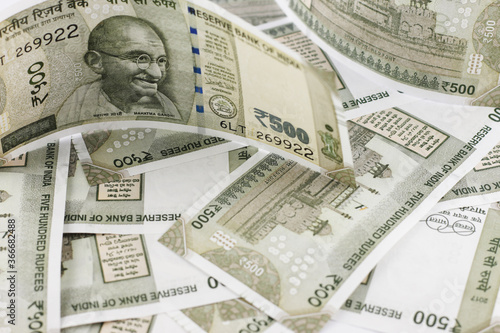 Indian currency notes of various denominations. Indian five hundred rupees note with other denominations in background. 