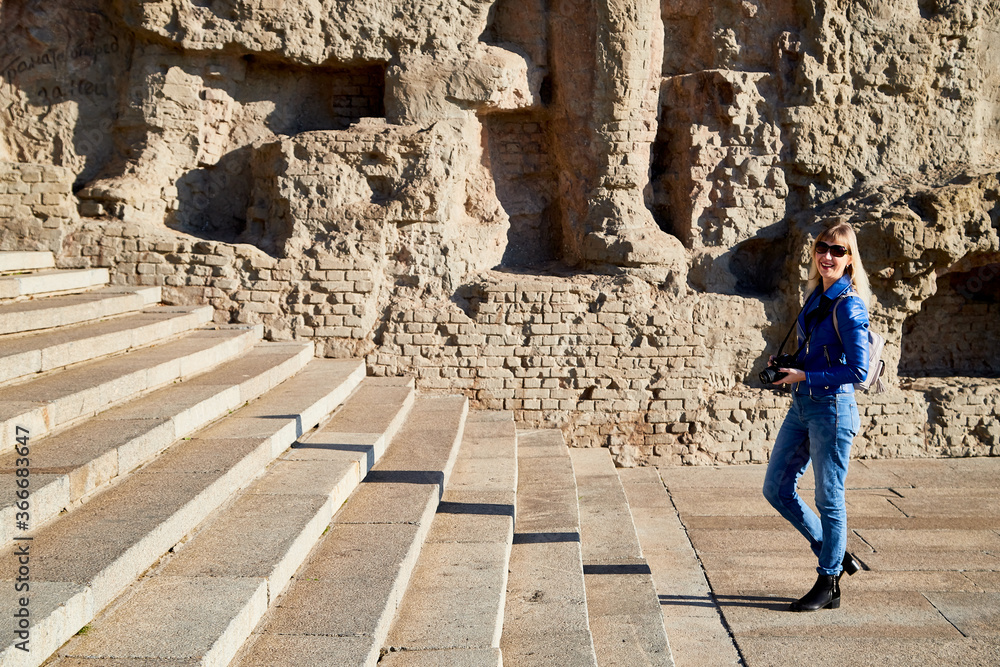 Volgograd, Russia - October 18, 2019: Tourist in park of historical war complex Mamaev Kurgan in Volgograd, Russia. Volgograd, Russia - October 18, 2019: Tourist in park of historical war complex Mamaev Kurgan in Volgograd, Russia.