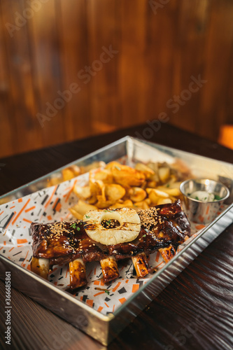 Close-up of a delicious barbecued prime rib with french fries