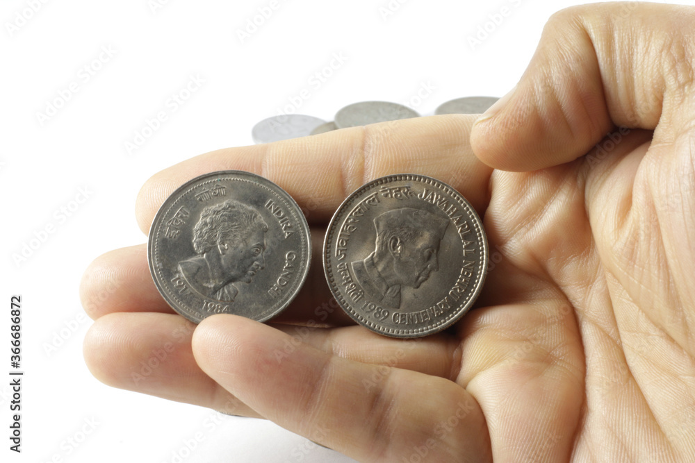 Currency coins of rupees five, rupee one, rupees two and more. Image depicting currency, expenses savings and investments. Currency coins of rupees five, rupee one, rupees two and more. Image depicting currency, expenses savings and investments.