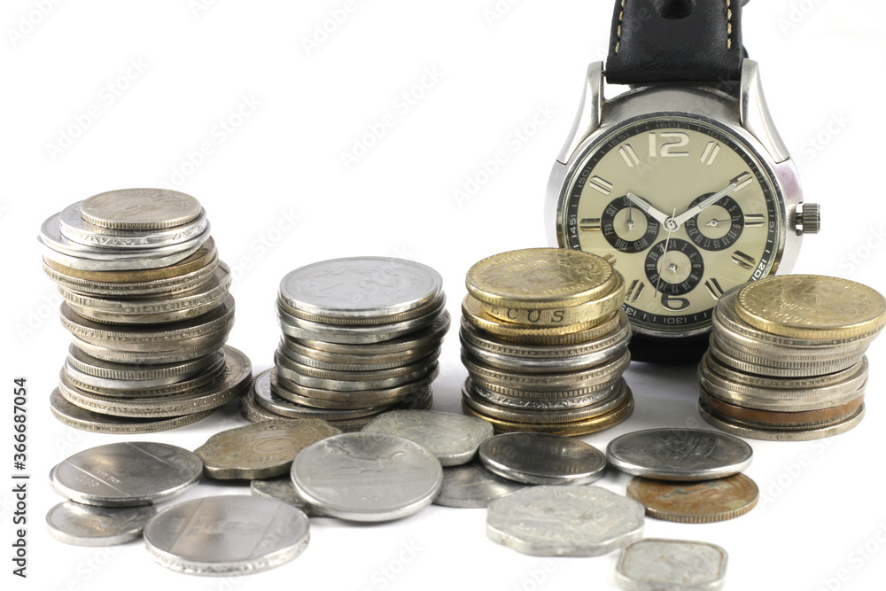 Concept of time and money depicted with a wrist watch and currency coins.