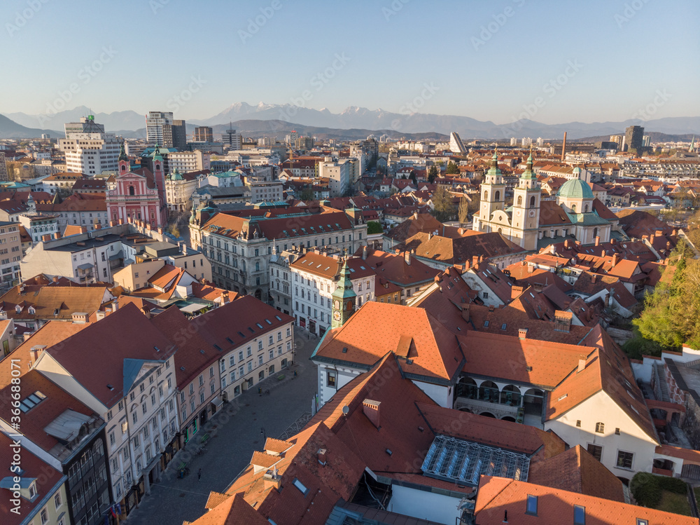 Naklejka premium Panoramic view of Ljubljana, capital of Slovenia, at sunset. Empty streets of Slovenian capital during corona virus pandemic social distancing measures in 2020.