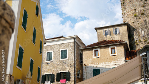 Old town, street, houses, windows. Beautiful elements of old towns in Montenegro.