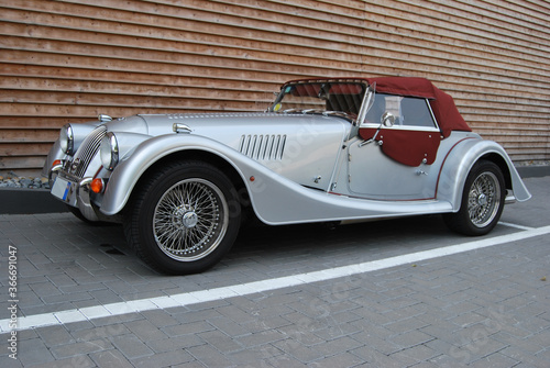 Billede på lærred silver convertible vintage car with burgundy hood