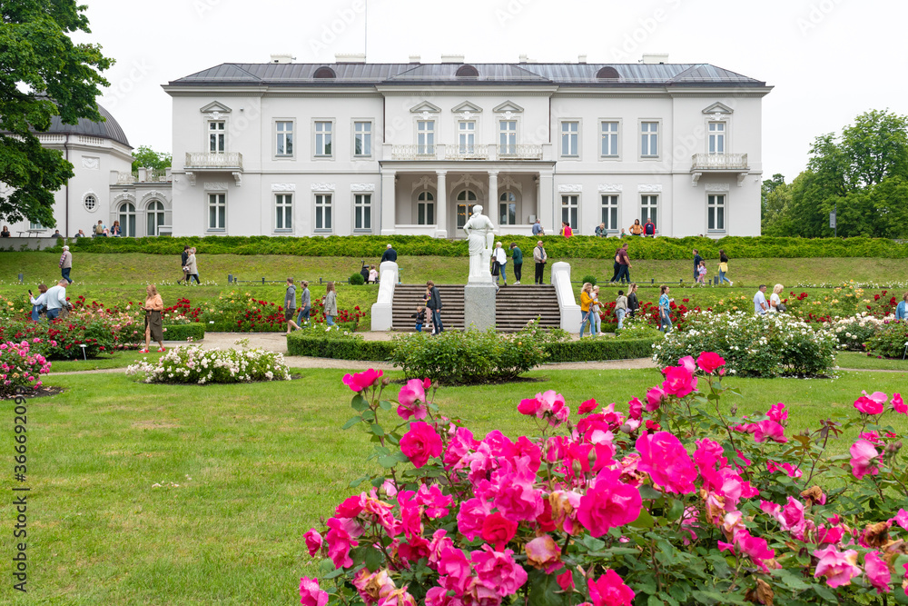 Obraz premium Amber museum in Palanga, Lithuania, view from the garden with flowers, roses and green grass