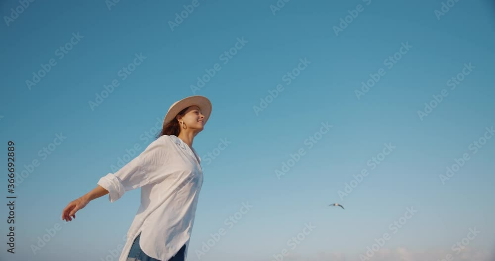 Young girl on the background of blue sky Young girl on the background of blue sky