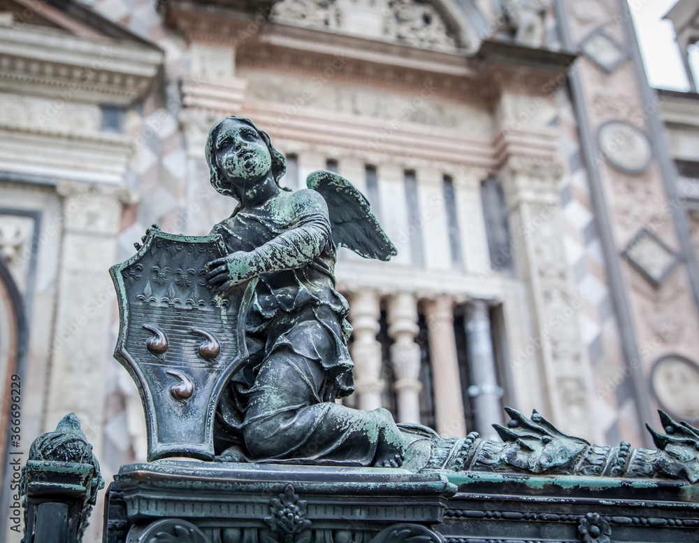 Bronze sculpture in the old square in front of the Duomo in Bergamo. Lombardy, Italy Bronze sculpture in the old square in front of the Duomo in Bergamo. Lombardy, Italy